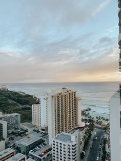 an aerial view of the ocean and buildings