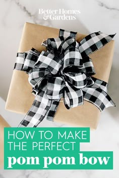 a brown box with a black and white bow on it that says make a pom - pom bow in less than 5 minutes