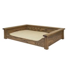 a dog bed made out of wood with a white pillow on top of it and a wooden frame