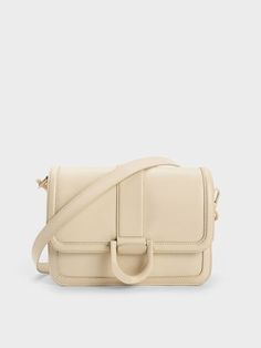 A classic rectangular bag is one of the foundational pieces in every women's wardrobe. This fresh chalk-white piece is one that will complement any look with ease. The Gabine buckle also comes in a matching white finish that makes this piece stand in all the right ways. Make full use of the bag's roomy interior and inner compartments to keep your everyday essentials and small leather goods neat and organised. Charles Keith Bags, Charles And Keith Bags, Charles And Keith, White Babydoll Dress, Eyewear Chain, Charles Keith, Sheep Leather, Leather Mules, Small Leather Goods