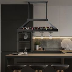 a modern kitchen with an island and stools