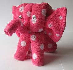 a pink stuffed elephant with white polka dots