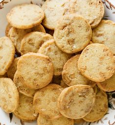 a white bowl filled with cookies on top of a table