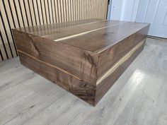 a large wooden box sitting on top of a hard wood floor