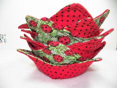 a bunch of red and black polka dots in a bowl