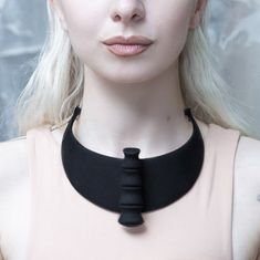 Make a statement with this futuristic black or white 3D printed nylon spinal neckpiece with an adjustable black plated silver chain. This statement jewellery sits comfortably across the collar.  To clean the piece:  gently rub it with a clean cloth soaked in warm water and soap      Sizing : One size MADE TO ORDER:   The lead tie is 15 days plus shipping since order placement Skeleton Necklace, Rough Quartz, Dark Jewelry, 3d Printed Jewelry, Nickel Free Jewelry, Stainless Steel Chain Necklace, Neck Accessories, Statement Choker, Printed Jewelry