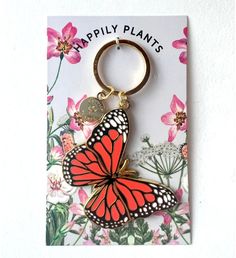 This beautiful Butterfly Keychain Makes the perfect gift for Butterfly and flower gardeners. Make your Mother's day or Birthday gift extra special. | This stunning Monarch butterfly pin is made of quality hard enamel and metal alloy for durability. The Keychain measures 3.8" tall x 2.5" wide. Designed and assembled by Holly of Happily Plants in New Jersey. | 1-800-Flowers Everyday Gift Delivery Monarch Butterfly Keychain Butterfly Keychain, Butterfly And Flower, Gift Delivery, Butterfly Pin, Butterfly Gifts, Everyday Gifts, Enamel Lapel Pin, Green Ribbon, Delivery Gifts