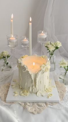 there is a cake with candles on the table