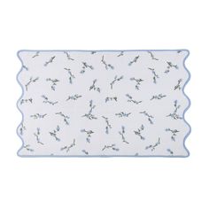 a blue and white placemat with small birds on it