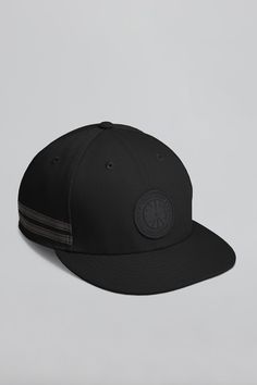 Designed in the New Era 9FIFTY low profile silhouette and featuring our signature double-stripe reflective details for added visibility in low light. An adjustable snapback strap gives a comfortable fit and a tonal black Silicone Arctic Disc logo finishes this style. Sporty Six-panel Snapback Hat With Logo Patch, Sporty Black Snapback Hat, Sporty Black Baseball Cap With Logo Patch, Sporty Black Six-panel Snapback Hat, Black Sporty Snapback Hat With Curved Visor, Black Adjustable Snapback Hat, Sporty Adjustable Fitted Hat With Logo Patch, Sporty Black Snapback Hat With Flat Brim, Sporty Adjustable Snapback Hat For Streetwear