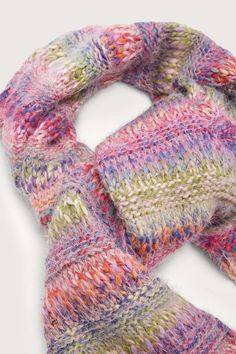 Stay warm and stylish with our Multicolored Knit Scarf. Crafted from soft, cozy knit fabric, this scarf features a beautiful gradient of red, orange, pink, green, blue, and purple hues. The fading design adds a touch of sophistication while still providing a vibrant pop of color. Pair it with our matching Multicolored Knit Beanie for a complete look. Perfect for chilly days in the city or any occasion where you need extra warmth and style. Made in India Colorful Knit Scarf, Warm Multicolor One-size Scarves, Warm Multicolor Scarves For Fall, Multicolor Scarves For Cold Weather In Fall, Cozy Multicolor Scarves For Cold Weather, Warm Multicolor Casual Scarves, Warm Casual Multicolor Scarves, Casual Warm Multicolor Scarves, Multicolor Acrylic Casual Scarves