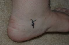 a person with a small tattoo on their foot