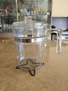 a glass jar sitting on top of a counter