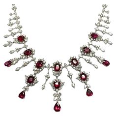 The Following Item we are offering is this Rare Important Radiant 18KT Gold Gorgeous Glittering and Sparkling Magnificent Fancy Unheated Natural Ruby and Diamond Fringe Necklace. Necklace contains over 30CTS of Beautiful Fancy Natural Unheated Rubies and Diamonds!!! Stones are Very Clean and Extremely Fine!!! This Gorgeous Necklace is a Rare Sample from A Top Private Manufacturer that sold to Important Five Star Hotel and the Finest Jewelry Stores. Comes New with Tags Original Price $275,000. A Ruby Diamond Necklace, Rubies And Diamonds, Fringe Necklace, Five Star Hotel, Royal Jewels, Ruby Diamond, Dream Jewelry, Natural Ruby, Drop Necklace