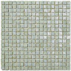 the back side of a glass mosaic tile with white and light green squares on it