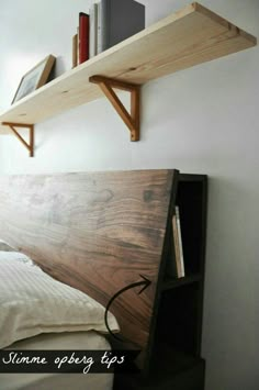 a bed with a book shelf above it