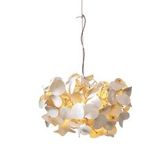 a light fixture with white flowers hanging from it