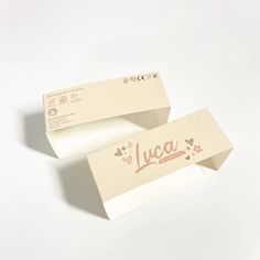 two white boxes with the word lucia printed on them are sitting next to each other