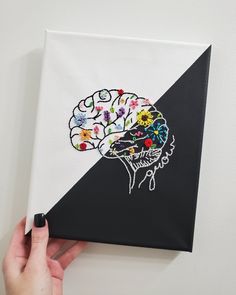 someone is holding up a piece of art that has been made to look like a human brain