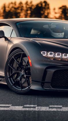 the front end of a gray sports car