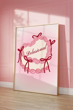 a pink wall with a framed sign that says,'delusionial'on it