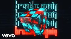 an animated cube with red and blue squares on it, surrounded by words that spell out the