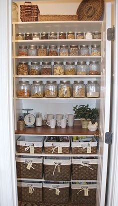 the pantry is stocked with many different types of food and storage items, including baskets