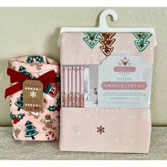 the pink and green christmas wrapping set is next to it's packaging bag with its contents