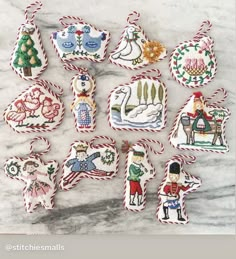 twelve handmade christmas ornaments on a marble surface