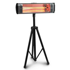 an outdoor heater sitting on top of a tripod with the light on it