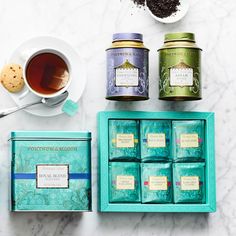 an assortment of teas and cookies on a table