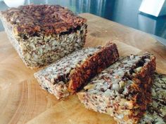 some granola bars are sitting on a cutting board