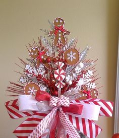 a christmas tree made out of gingerbreads and candy canes