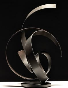 an artistic sculpture is displayed on a black background