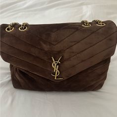 New/Never Worn Loulou Medium Ysl Shoulder Bag In Brown Suede. Includes Tags And Dust Bag. Saint Laurent "Loulou" Shoulder Bag In Y-Quilted "Softy" Suede. Sliding Chain/Leather Shoulder Strap May Be Doubled; 9.8"-19.3" Drop. Envelope Flap With Signature Ysl Hardware. Bronze Hardware. Interior, Two Main Compartments Separated By A Zip Pouch; One Zip Pocket Approx. 8"H X 11.5"W X 4"D. Ysl Bag Brown, Ysl Suede Bag, Ysl Loulou Bag, Ysl Shoulder Bag, Ysl Bags, Dream Bags, Bronze Hardware, Material Girl, Saint Laurent Bag