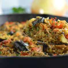 a close up of a spoon with food in it