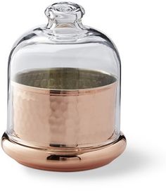 a glass dome with a metal base underneath it