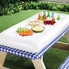 an inflatable picnic table with food on it