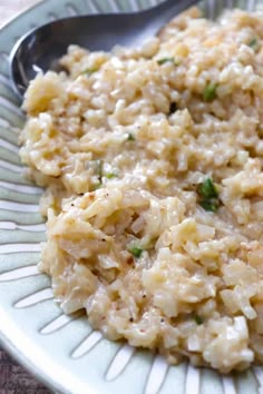 a bowl filled with rice on top of a table