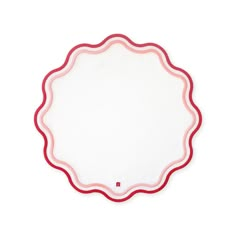 a white plate with red trim around the edges on a white background, top view