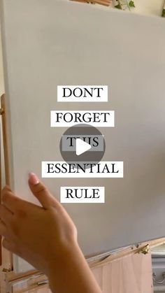 someone is pointing to the wall with words on it that read, don't forget its essential rules