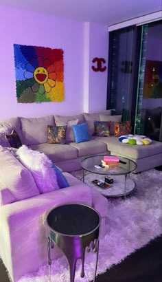 a living room filled with furniture and purple walls