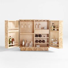 an open wooden cabinet with bottles and glasses in the bottom section, on a white background