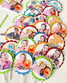 a bunch of cupcake toppers with pictures of people on them