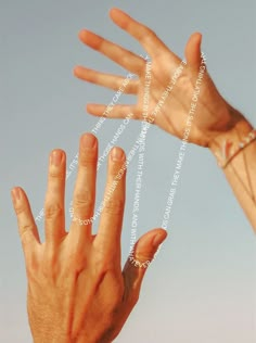 two hands reaching up towards each other with words written on them