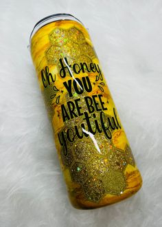 a yellow glittered can with the words honey you are bee yourself on it