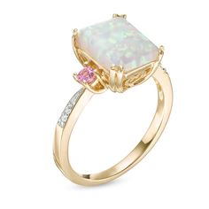 Fashioned in 10K gold, this three stone ring features a 10.0 x 8.0mm emerald-cut lab-created opal center stone flanked on either side by two lab-created pink sapphires with diamond accents lining the ring's shank. Pink Opal Ring, Frame Ring, Opal Ring Gold, Three Stone Ring, Engagement Rings Opal, Tourmaline Ring, Emerald Stone, Cute Rings, Sapphire Stone