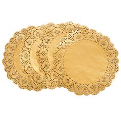 four gold doily plates on a white background