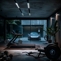 a car is parked in the garage next to exercise equipment and a gym with machines