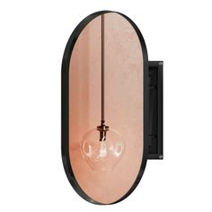 an oval mirror mounted to the side of a wall with a light bulb hanging from it